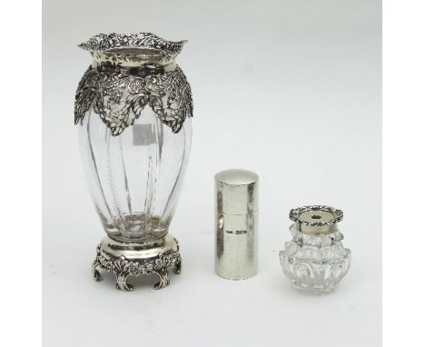 A silver mounted glass vase, William Comyns, London 1899, the lobed vase with pierced scrolling mounts to the shoulder and fo