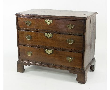 A George III oak chest of three long drawers on bracket feet, 94cm wide