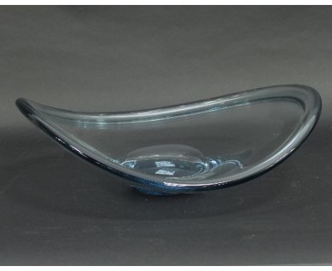 Per Lutken (1916-1998) for Holmegaard: a clear glass bowl of irregular circular form with a slight blue tint, 39.5cm wide