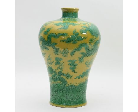 A Chinese yellow and green glaze meiping vase, apocryphal seal mark of Qianlong, incised decoration of dragons within clouds,