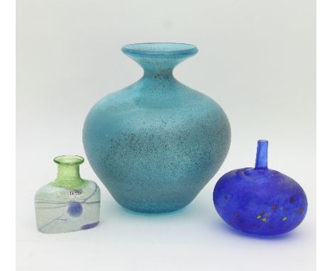 Kosta Boda: a blue glass bottle vase, with tall slim neck, 9.5cm high, a larger turquoise art glass vase, 16cm high and a sma