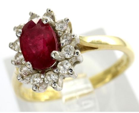 18ct gold ring set with a central ruby and diamond cluster, size J/K, 2.8g. P&amp;P Group 1 (£14+VAT for the first lot and £1