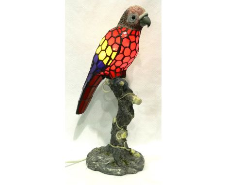 Painted glass parrot table lamp on a naturalistic resin base, H: 47 cm. All electrical items in this lot have been PAT tested