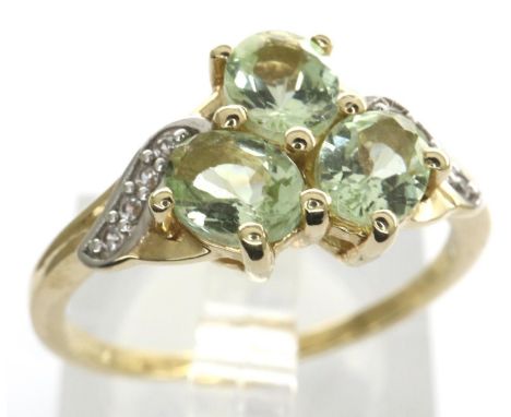 10ct gold emerald trilogy ring set with CZ stones, size N/O, 2.4g. P&amp;P Group 1 (£14+VAT for the first lot and £1+VAT for 