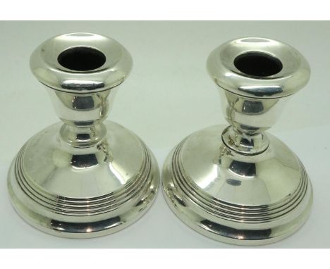 Pair of hallmarked silver candlesticks with bakelite bases, H: 10 cm, hallmarks faded but visible, light scratches nut no den