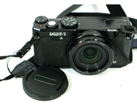 Pentax MK-1 digital camera, no charger present so unable to say if working, battery is present and free of corrosion. P&amp;P