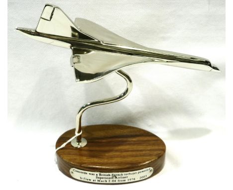 Chrome Concorde on wooden base, H: 22 cm. P&amp;P Group 2 (£18+VAT for the first lot and £3+VAT for subsequent lots) 