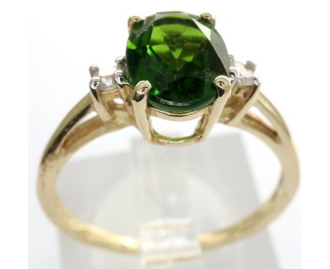 10ct gold solitaire ring set with CZ stones and a central emerald, size N/O, 1.9g. P&amp;P Group 1 (£14+VAT for the first lot