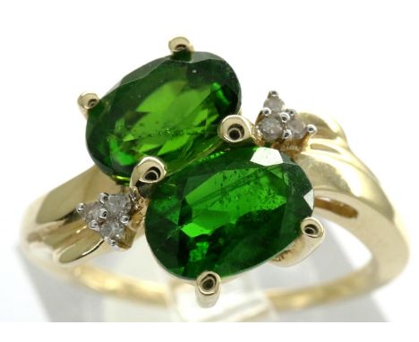 10ct gold dress ring set with six diamonds and two emeralds, size M, 2.6g. P&amp;P Group 1 (£14+VAT for the first lot and £1+