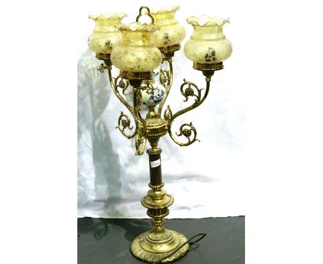 Large brass and ceramic three branch lamp with glass shade, H: 85 cm. All electrical items in this lot have been PAT tested f