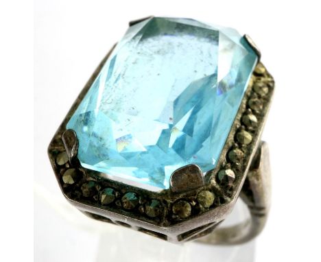 Silver and marcasite ring set with large blue stone size O, stone 21 mm. P&amp;P Group 1 (£14+VAT for the first lot and £1+VA