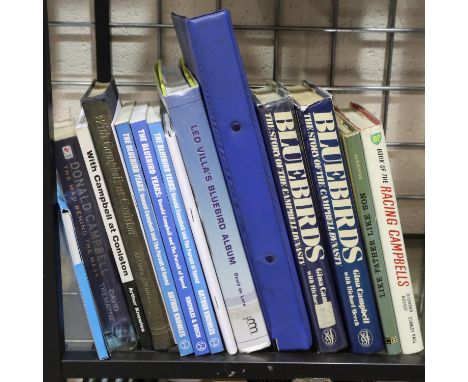 Shelf of Donald and Malcolm Campbell books and ephemera. Not available for in-house P&amp;P 