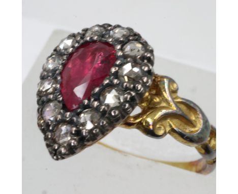 Unmarked 19th century 18ct gold ring set with pear shaped ruby in foiled back setting with rose cut diamond surround, size N/