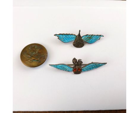 Two silver and enamel parachute regiment badges/brooches and a brass button with an eagle. 