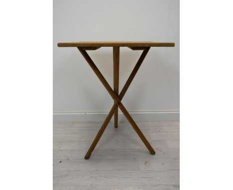 A vintage cross legged table. H.78 W.53 D.46 cm. 
