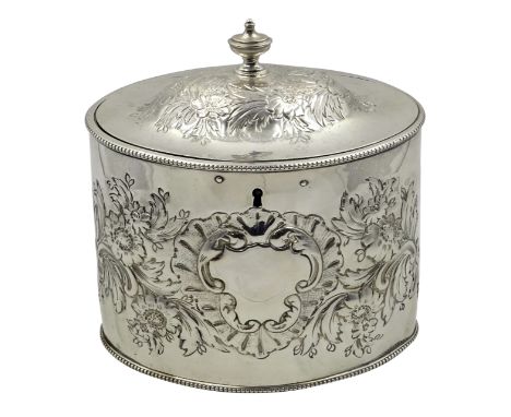 George III silver oval tea caddy, embossed flower decoration by I.B London 1786, H14.5cm, approx 13oz. Provenance; Property o