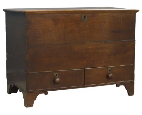 George lll oak mule chest with hinged top and interior candle box above two cockbeaded drawers with turned wooden handles on 