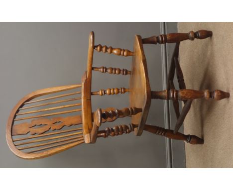 19th century elm broad arm Windsor chair, shaped and pierced splat and stick back, dished seat, turned supports with double '