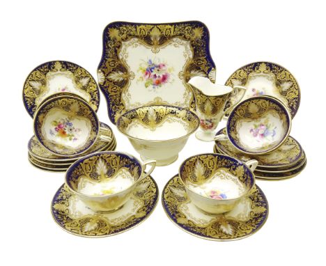 Early 20th century Royal Worcester tea service for six persons hand painted with floral sprays by Ernest Phillips within a ro