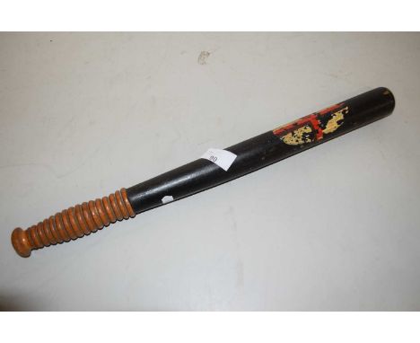 A vintage truncheon with turned wooden handle and stem painted with St Georges Cross