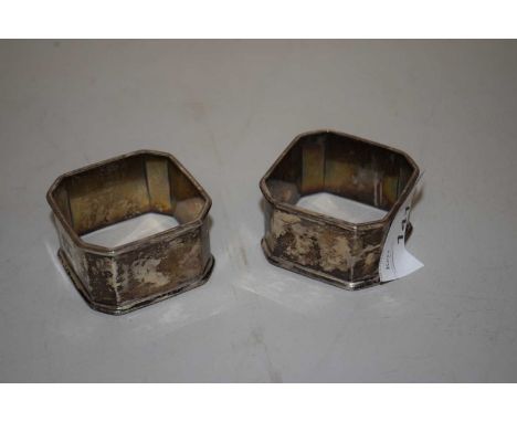 A pair of silver napkin rings