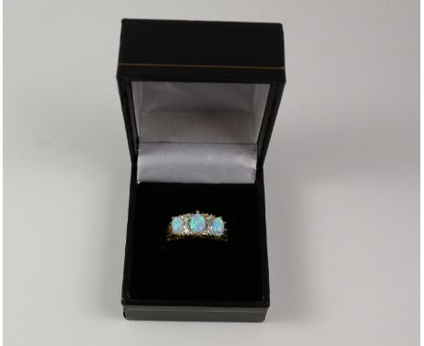 Silver-gilt three stone opal ring Condition Report Click here for further images, condition, auction times & delivery costs
