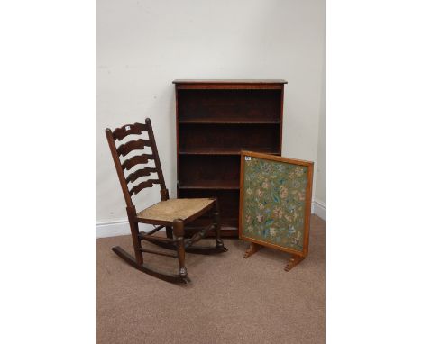 20th century oak ladder back rocking chair with rush seat, oak metamorphic firescreen/table with needlework panel and an oak 