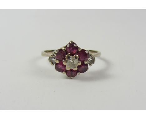 Ruby and diamond white gold cluster ring stamped 18ct Condition Report Click here for further images, condition, auction time