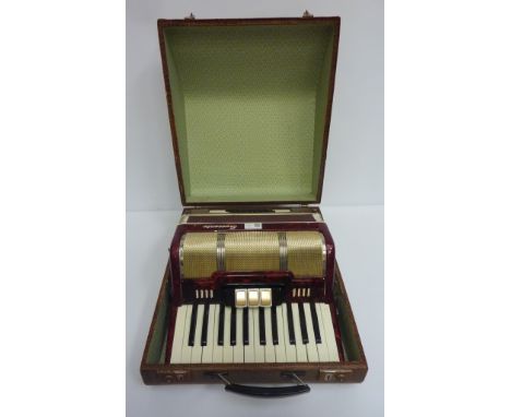 'Sorrento' piano accordion No. 4005 with red marble finish, cased  Condition Report Click here for further images, condition,