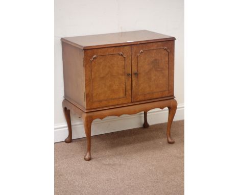 Reproduction walnut two door cupboard raised on cabriole legs, W64cm, H70cm, D38cm Condition Report Click here for further im