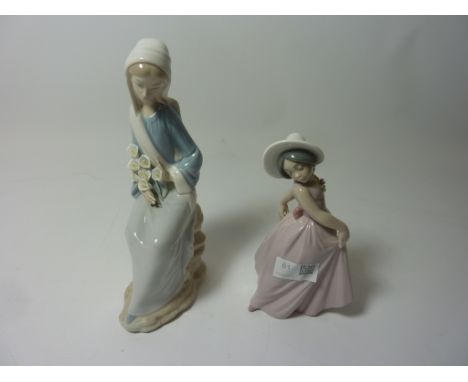 Two Lladro figurines - Seated lady with lilies, H 24cm and 'Iris' No. 6276 Condition Report Click here for further images, co