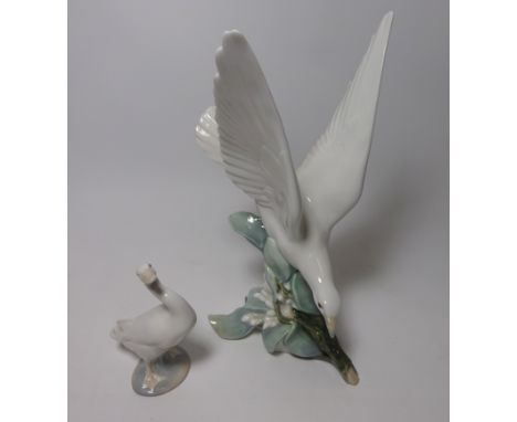 Lladro dove figurine perched on a branch and Lladro goose  Condition Report Click here for further images, condition, auction