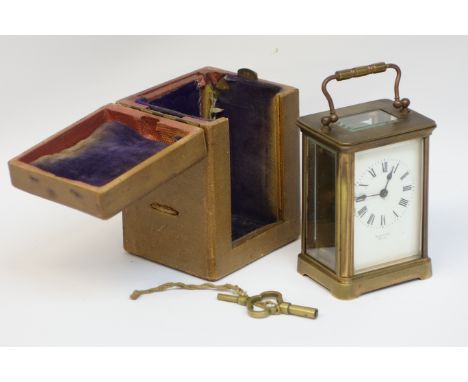 Cased brass carriage clock by Barlow Paris, mounted by handle over moulded cornice white face, Roman numerals, raised on brac