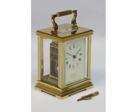 20th century brass and bevel glazed eight day carriage clock,by Sewills of Liverpool, mounted by reeded handle, moulded corni