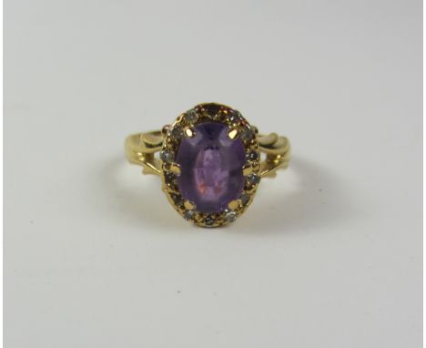 Amethyst and diamond cluster gold ring the fancy shank hallmarked 18ct Condition Report Click here for further images, condit