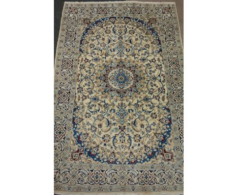 Fine Nain carpet with central medallion, over cream ground allover floral design spandrels, triple boarder, 300cm x 196cm Con