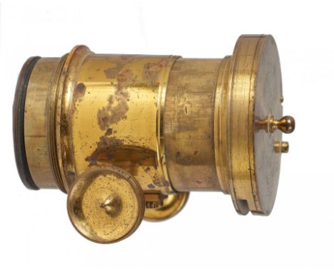 AN ENGLISH BRASS MAGIC LANTERN LENS focusing by rackwork, approx 5cm diam, threaded attachment with slot and pivoted lens fla