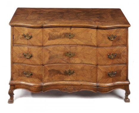 A SOUTH GERMAN SERPENTINE WALNUT COMMODE, MID 18TH C  the quarter veneered top, sides and drawers with figured centre in line