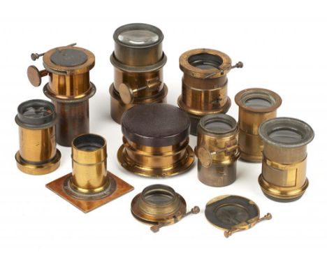 NINE ENGLISH AND GERMAN BRASS PETZVAL AND OTHER PORTRAIT CAMERA AND MAGIC LANTERN LENSES, C1870-1900++Fair to good condition 