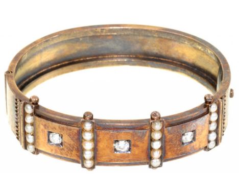 A VICTORIAN DIAMOND, SPLIT PEARL AND GOLD BANGLE, C1880  60mm, 17.6g++One or two very minor dents and scratches, not distorte