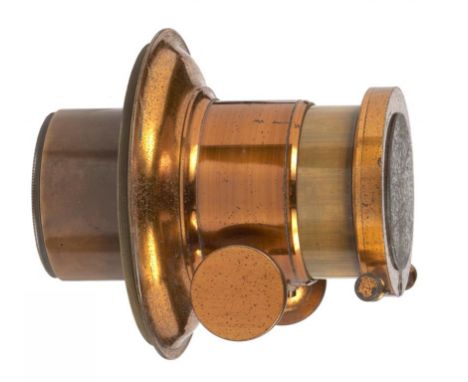 AN ENGLISH BRASS 7 INCH PETZVAL MAGIC LANTERN LENS, C1895 focusing by rackwork with integral fitted mounting plate, approx 5c