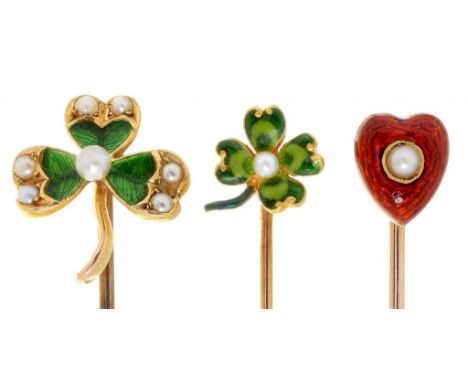 THREE GOLD STICKPINS,  C1900  each with seed pearl and green or cherry red guilloche enamel terminal, terminals 8-14mm, one m