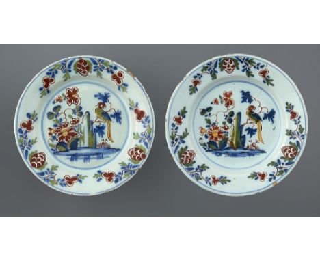 TWO MATCHING ENGLISH DELFTWARE PLATES, LAMBETH, C1770 painted with a long tailed bird on a branch, 22cm diam++Small spots of 