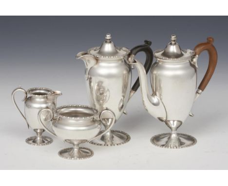 A FOUR PIECE SILVER TEA SERVICE   teapot 17cm h, by The Goldsmiths &amp; Silversmiths Co Ltd, London 1909, the jug, sugar bow