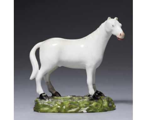 A RARE DERBY MODEL OF A WHITE HORSE, C1820  9.5cm hFor the example in the Victoria &amp; Albert Museum (C1305-1919) see Twitc