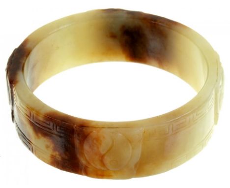 A CHINESE CARVED NEPHRITE BANGLE, 19TH/20TH C  with ying and yang, 73mm++Good condition
