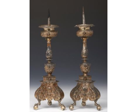 ANTWERP.  A PAIR OF NETHERLANDISH SILVER ARMORIAL ALTAR CANDLESTICKS the leafy baluster with compressed upper and ovoid lower