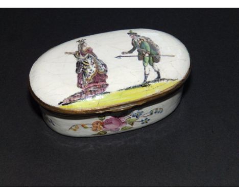 An 18thC oval enamelled snuff box , decorated transfer printed figures and floral painted sprays, 3” across
