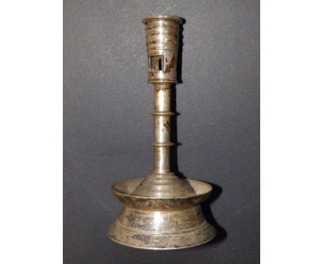 A mediaeval style silvered candlestick
