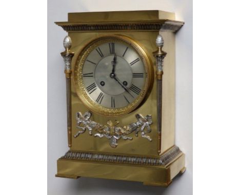 A French brass cased eight day striking mantel clock by Marti & Cie, having silvered neoclassical decoration to the rectangul